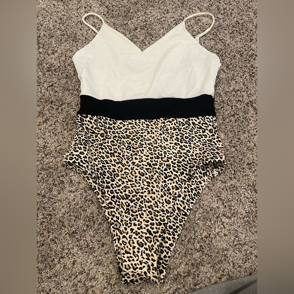 Kittenish one piece reversible swim suit